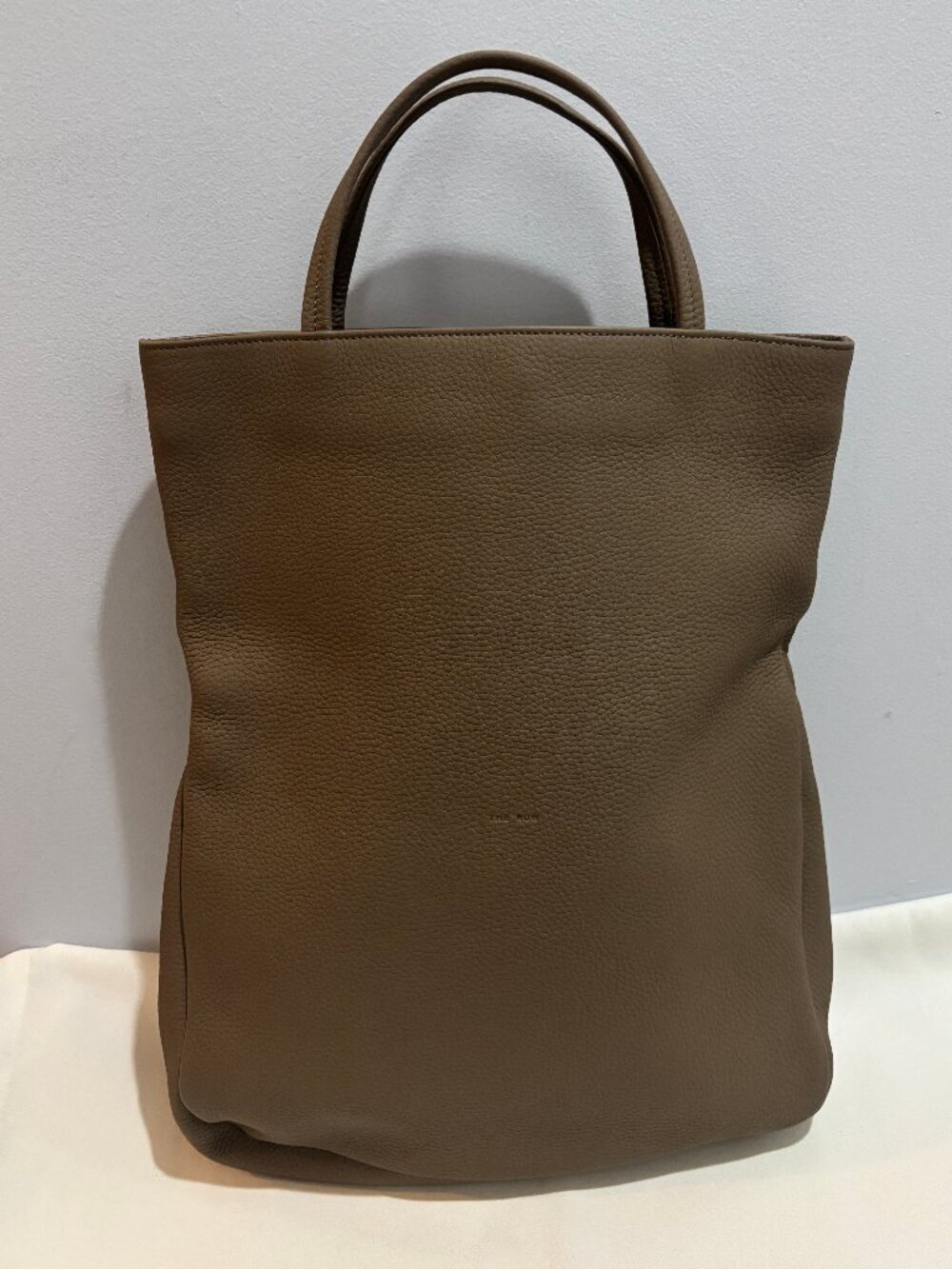 THE ROW FOLDABLE LEATHER SMALL TOTE/CLUTCH BAG, TAUPE